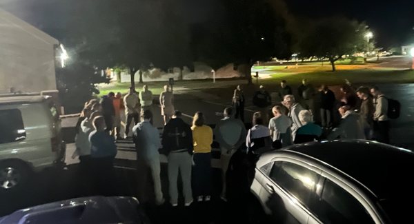 Church family praying over the Kenya mission team before departure